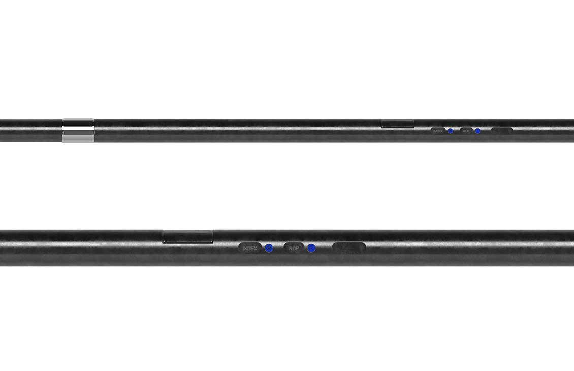 Close-up view of a black downhole drilling tool showing labeled indicator sections and sensor placement along the tool body.