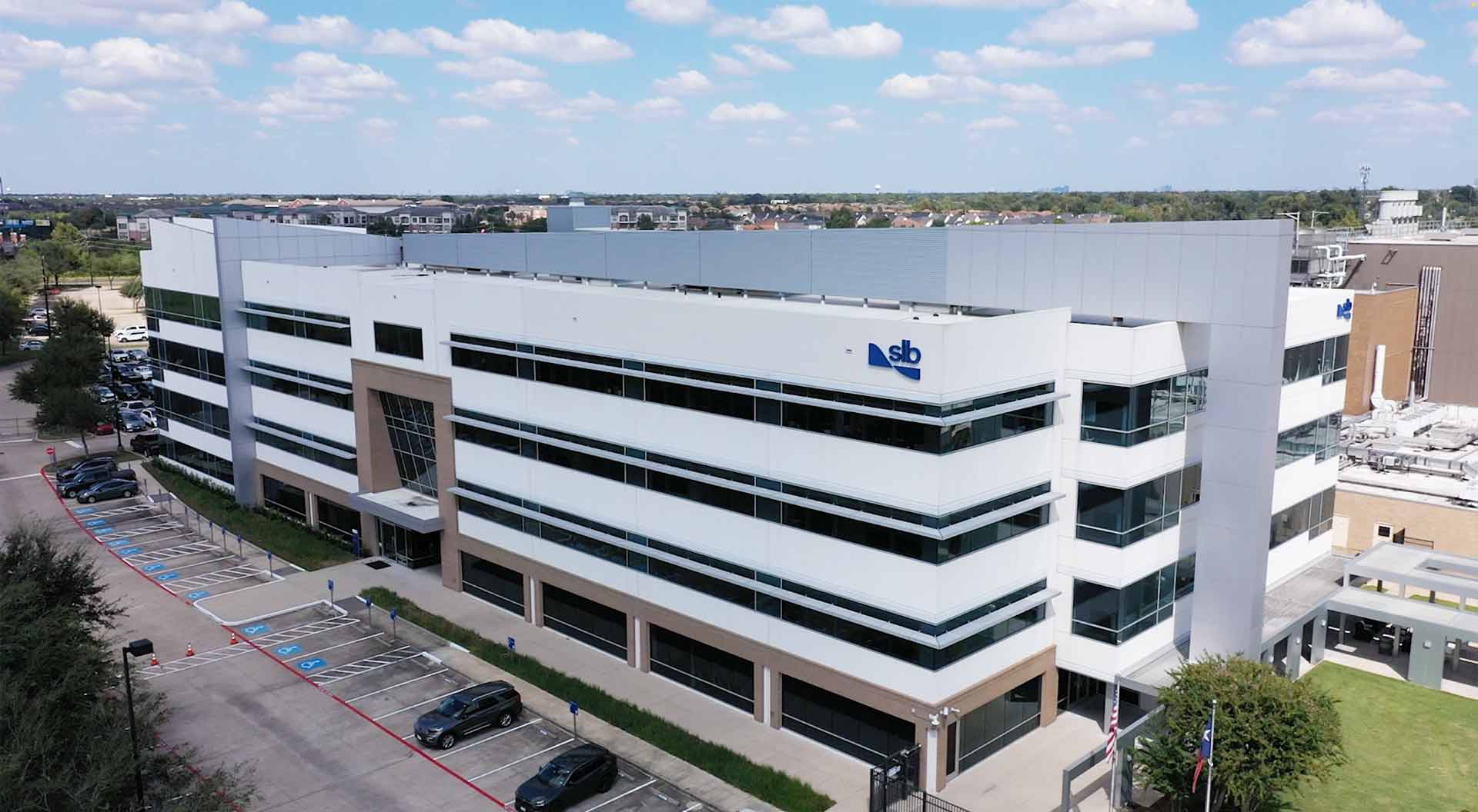 Photograph of the exterior of the SLB Production Chemicals Technology Center in Sugar Land, Texas.