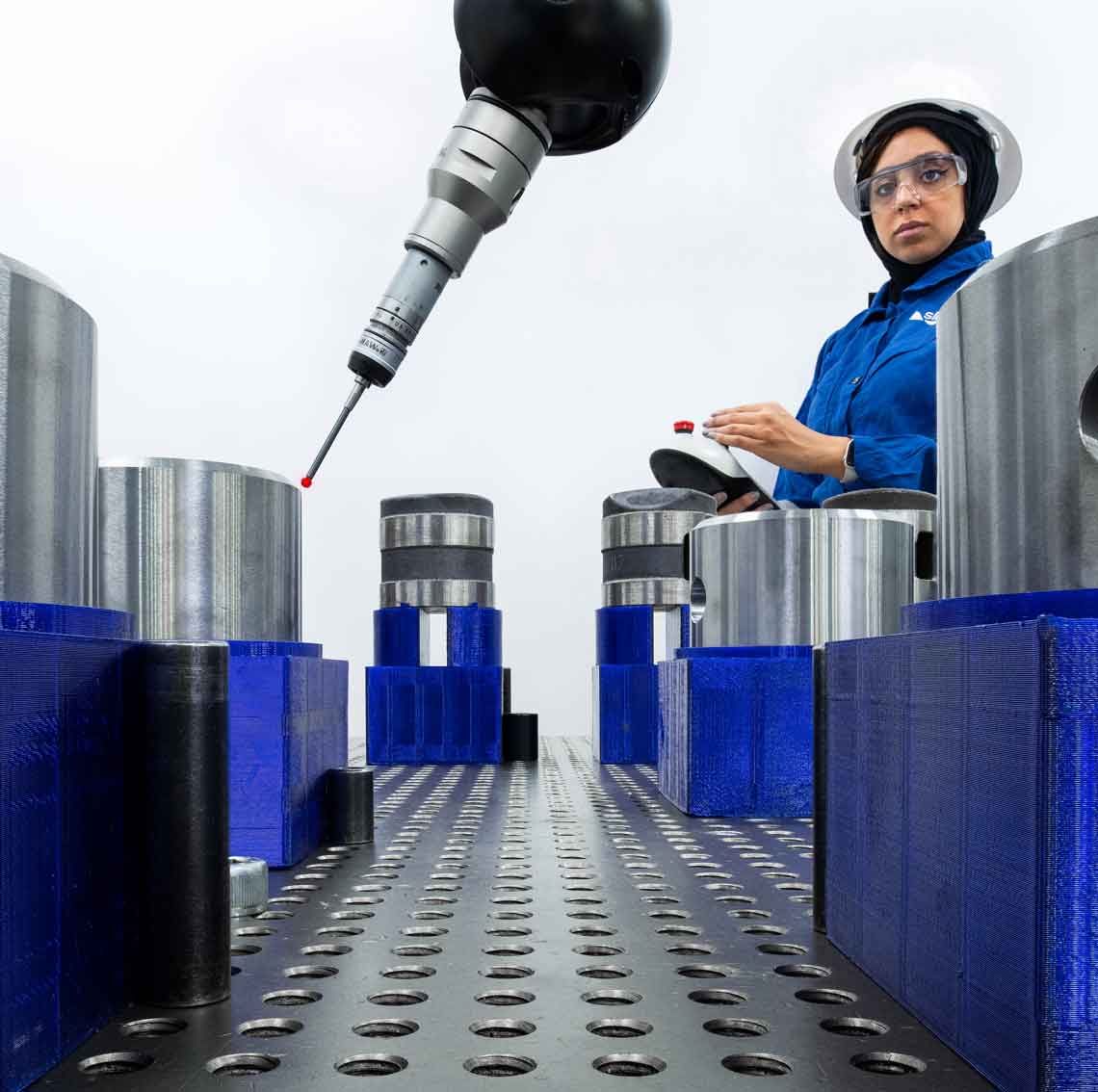 Female operator performing a testing procedure on equipment