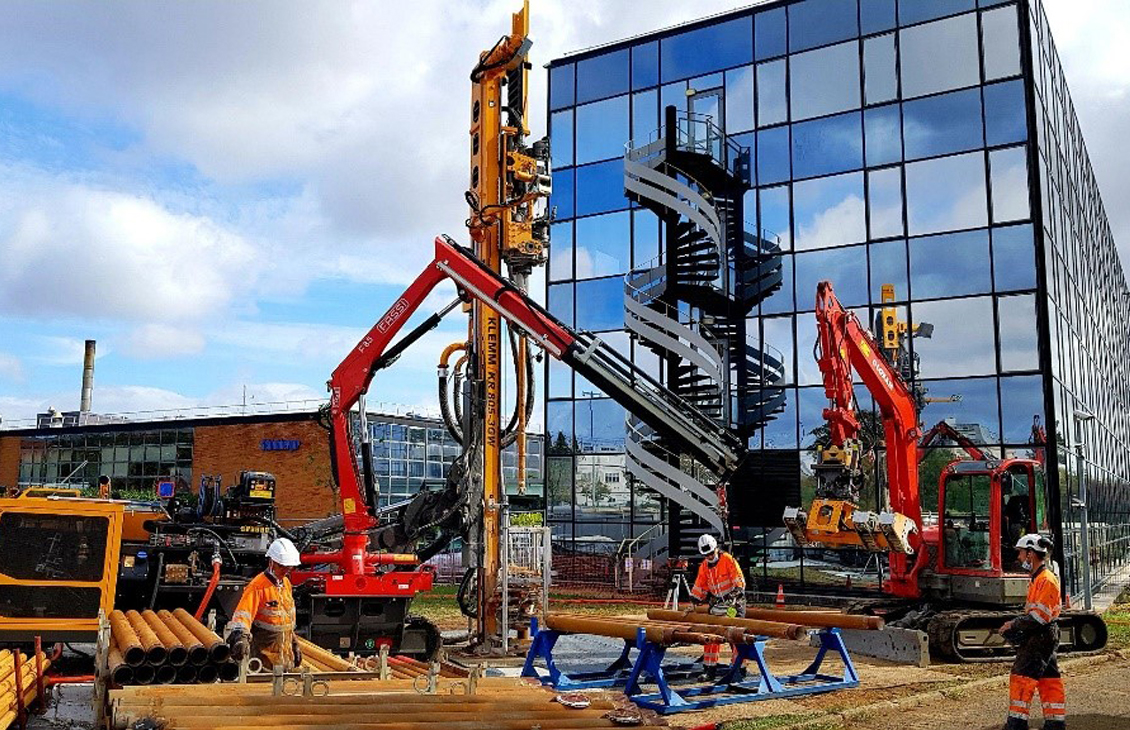 Drilling rig in front of building