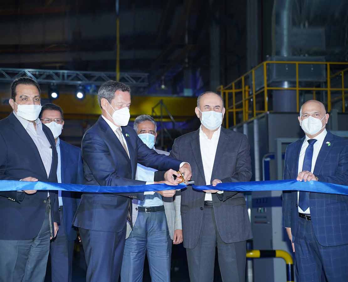 Executives at a ribbon cutting ceremony