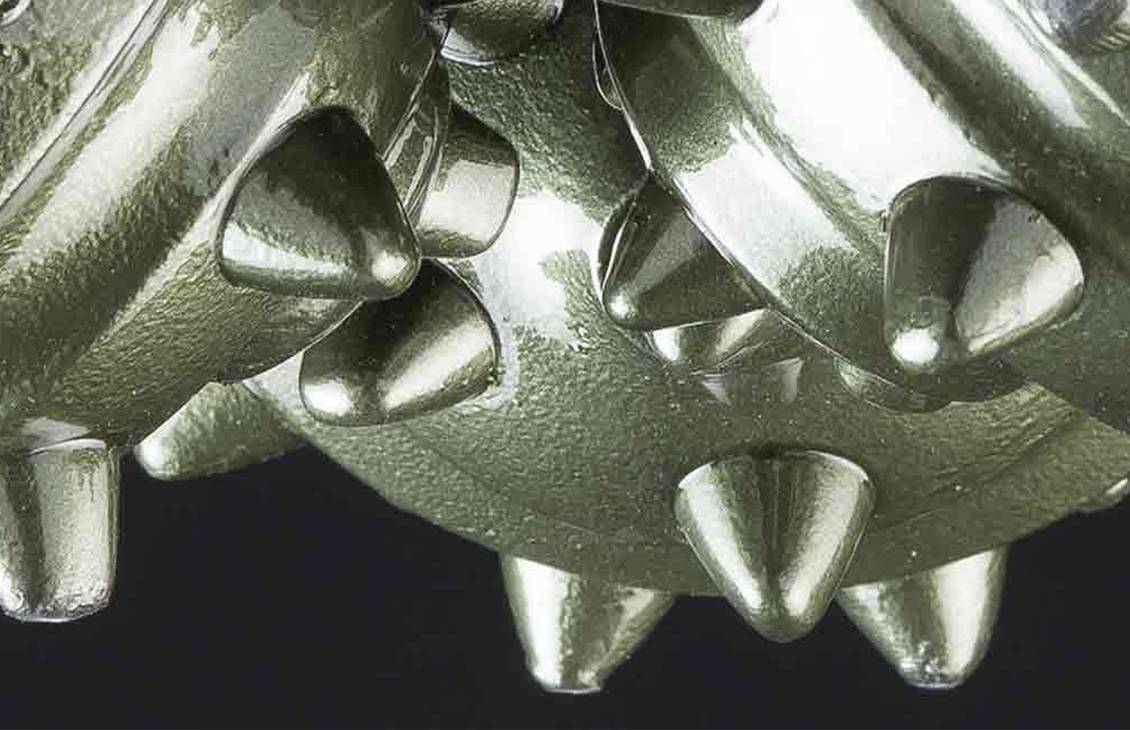 Closeup of Xplorer Helix roller cone bit showing cutting structure