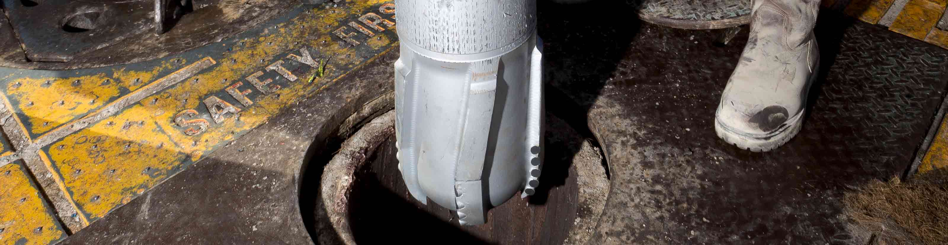 TDDirect bit being guided downhole on rig floor