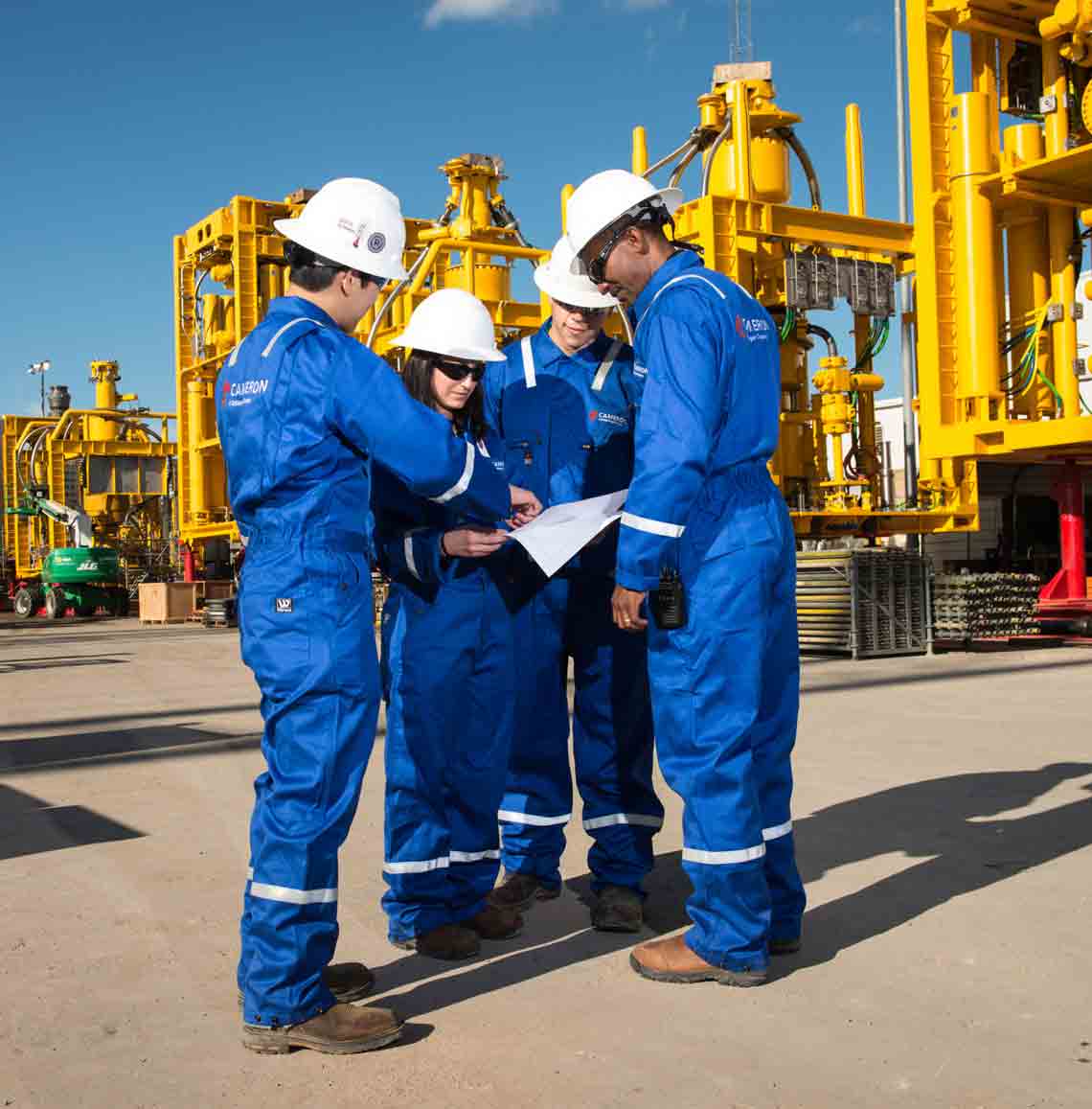 Cameron team reviewing paperwork onsite