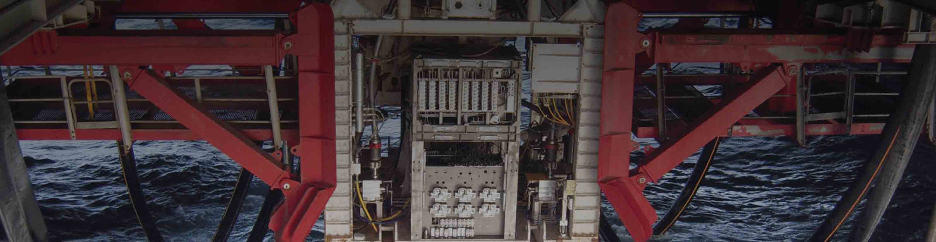 Installation of a control pod used in our MUX systems being lowered into the ocean.