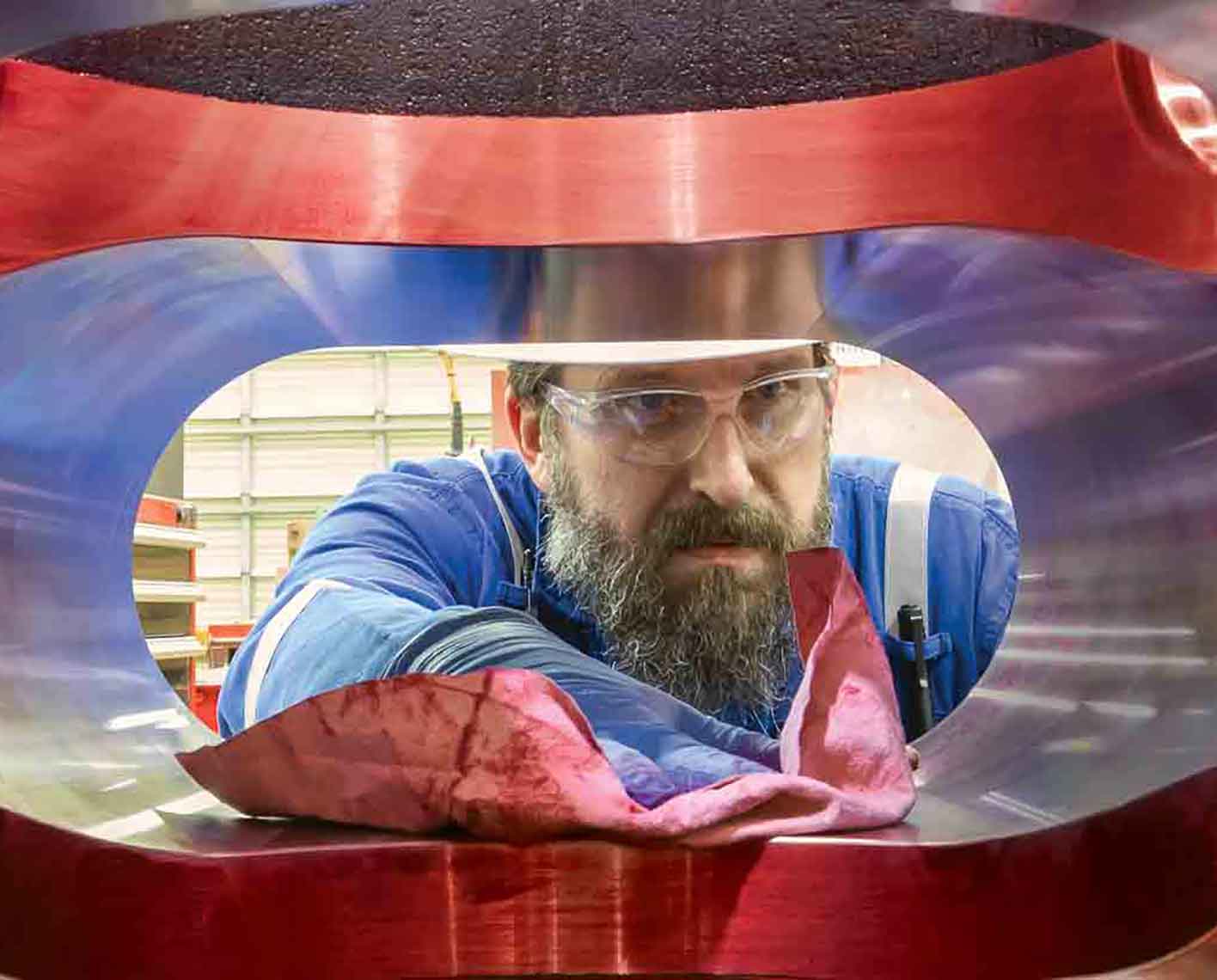 Operator cleaning the inside of a red BOP