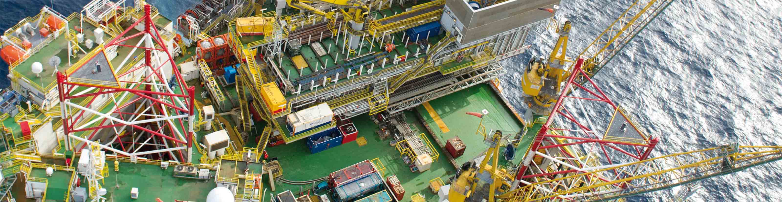 Drillship on water viewed from above.