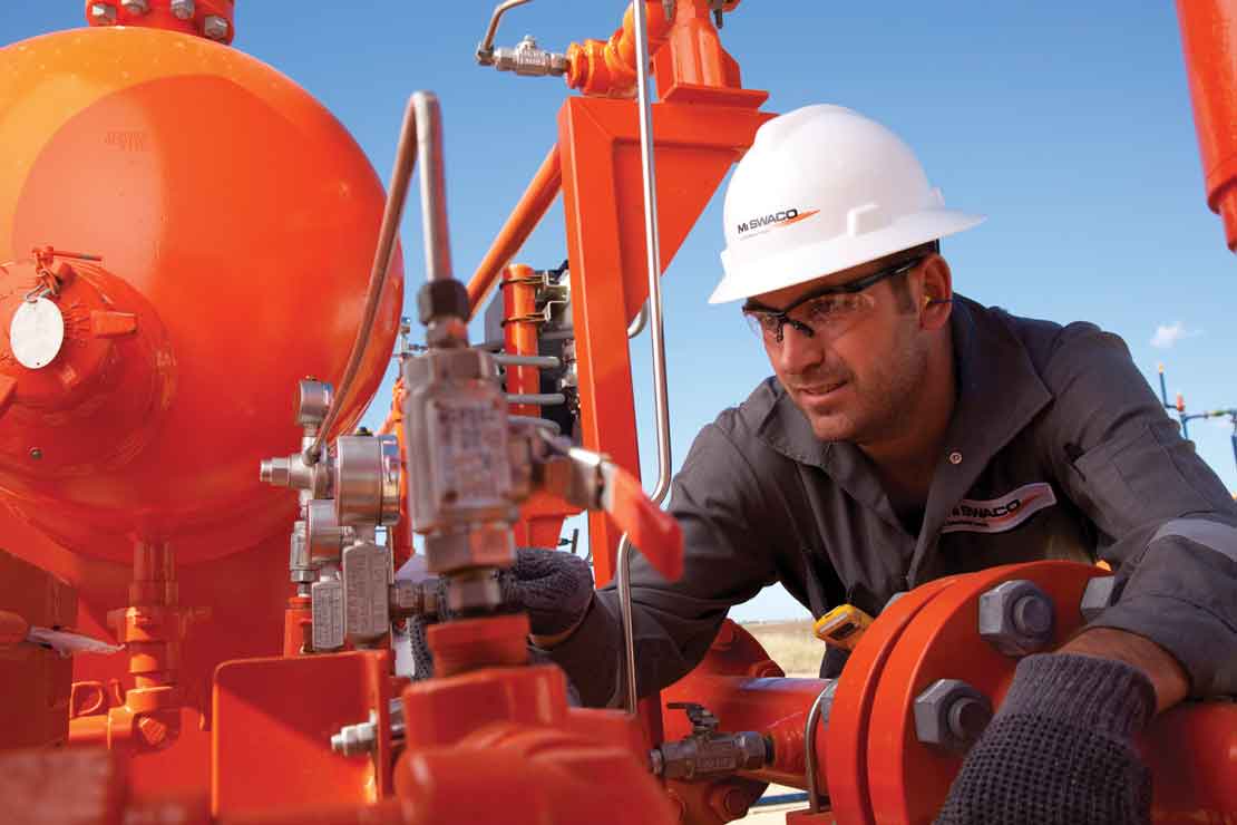 Operator inspecting a gas separator