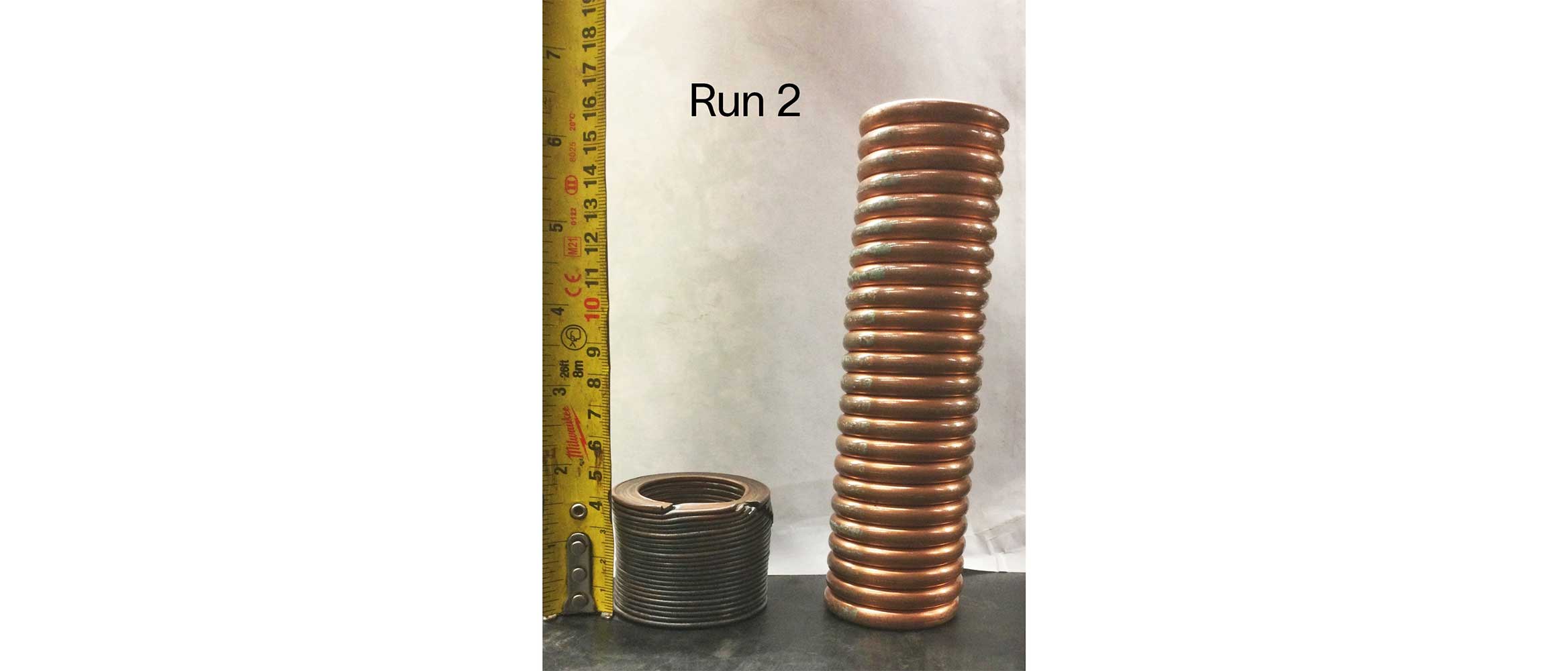 Photo of shock absorber to protect tractor and electronics, after (left) and before (right) perforation.