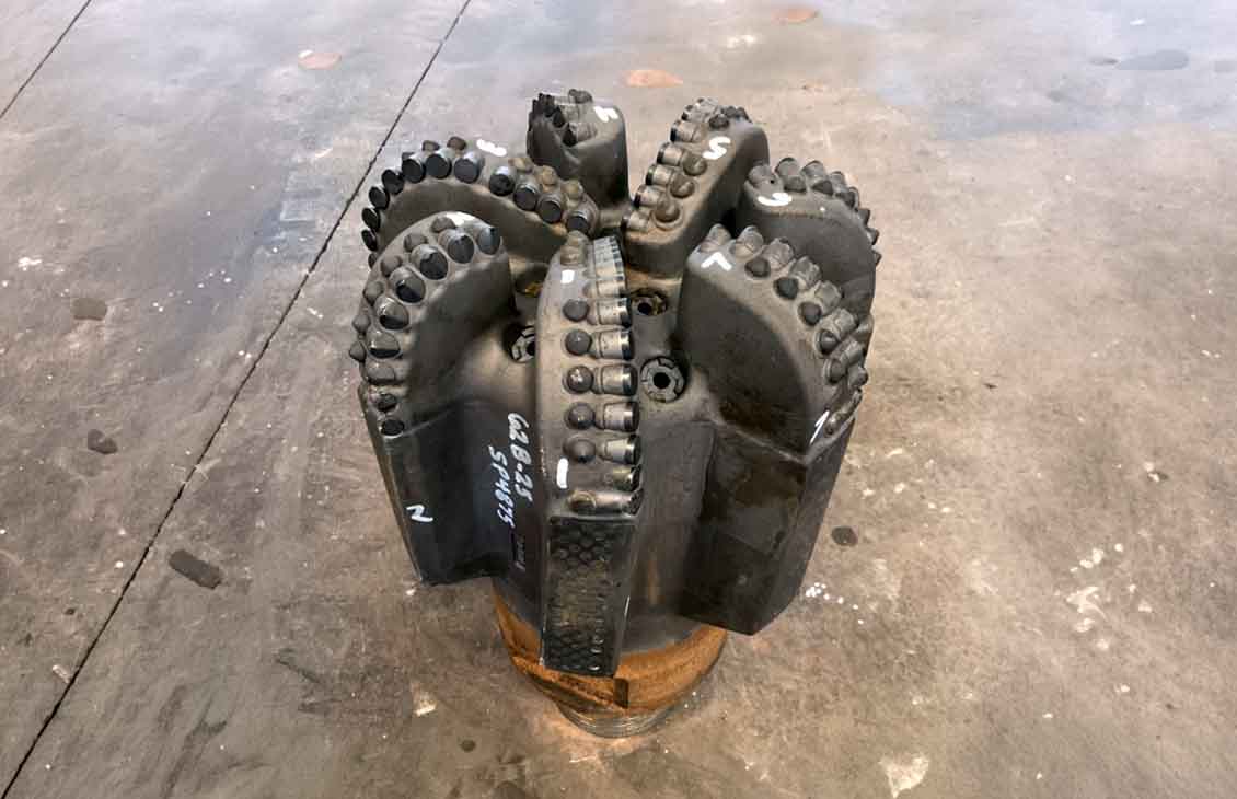 12.25-in. AxeBlade bit equipped with StingBlade diamond elements for drilling hard, abrasive geothermal formations.