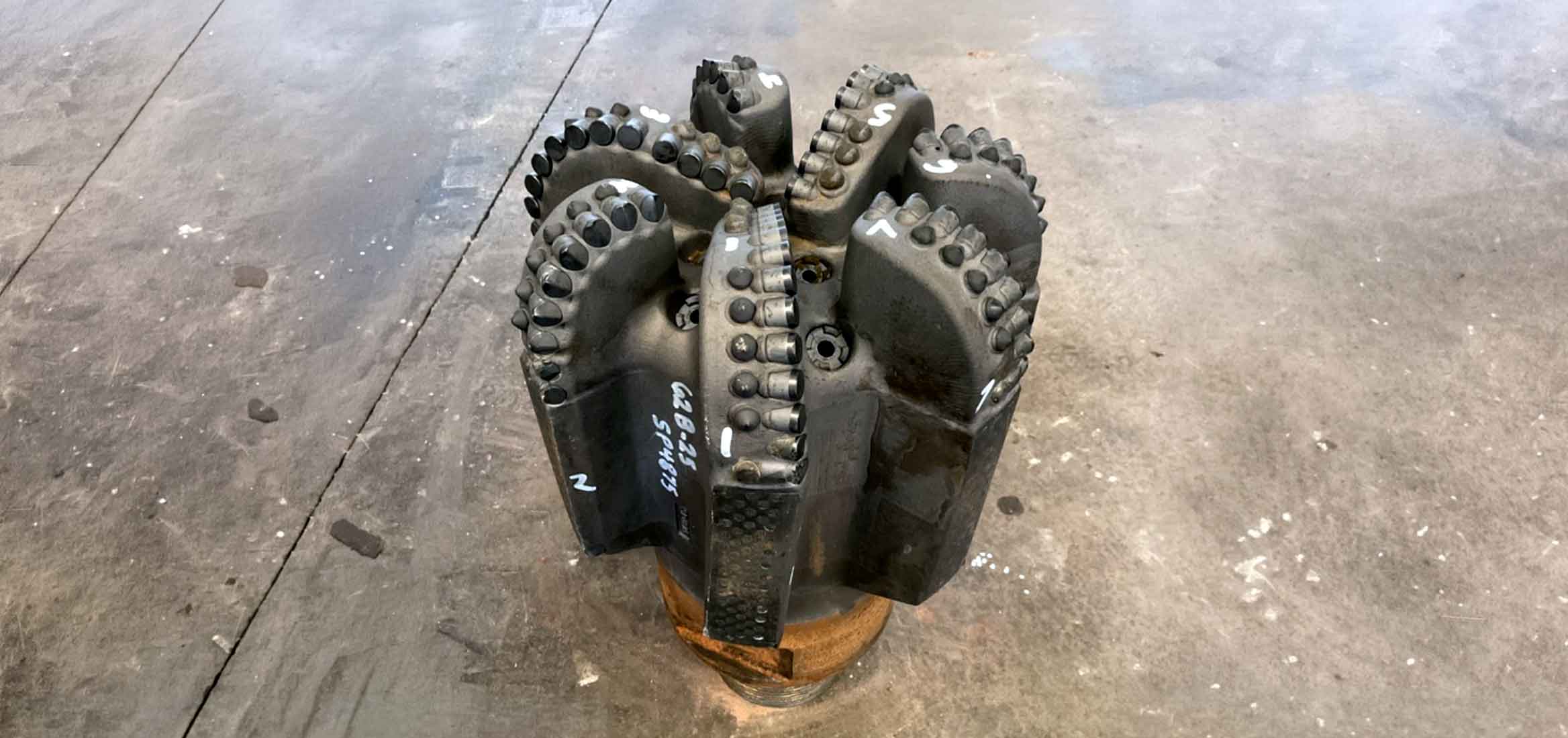 12.25-in. AxeBlade bit equipped with StingBlade diamond elements for drilling hard, abrasive geothermal formations.