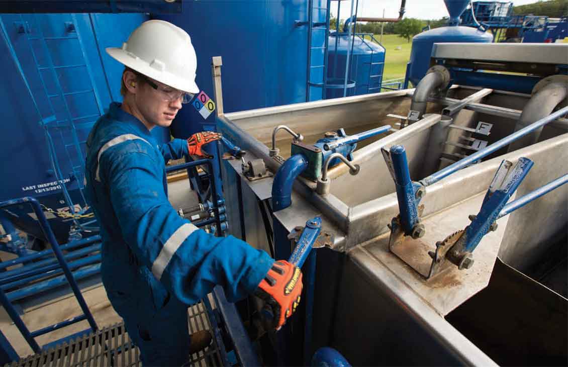 Operator working on cementing equipment