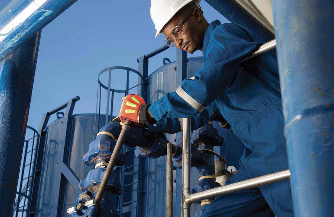 SLB operator working on well decommissioning equipment.