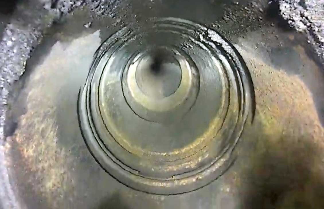 Internal view of wellbore with a camera during leak investigation.