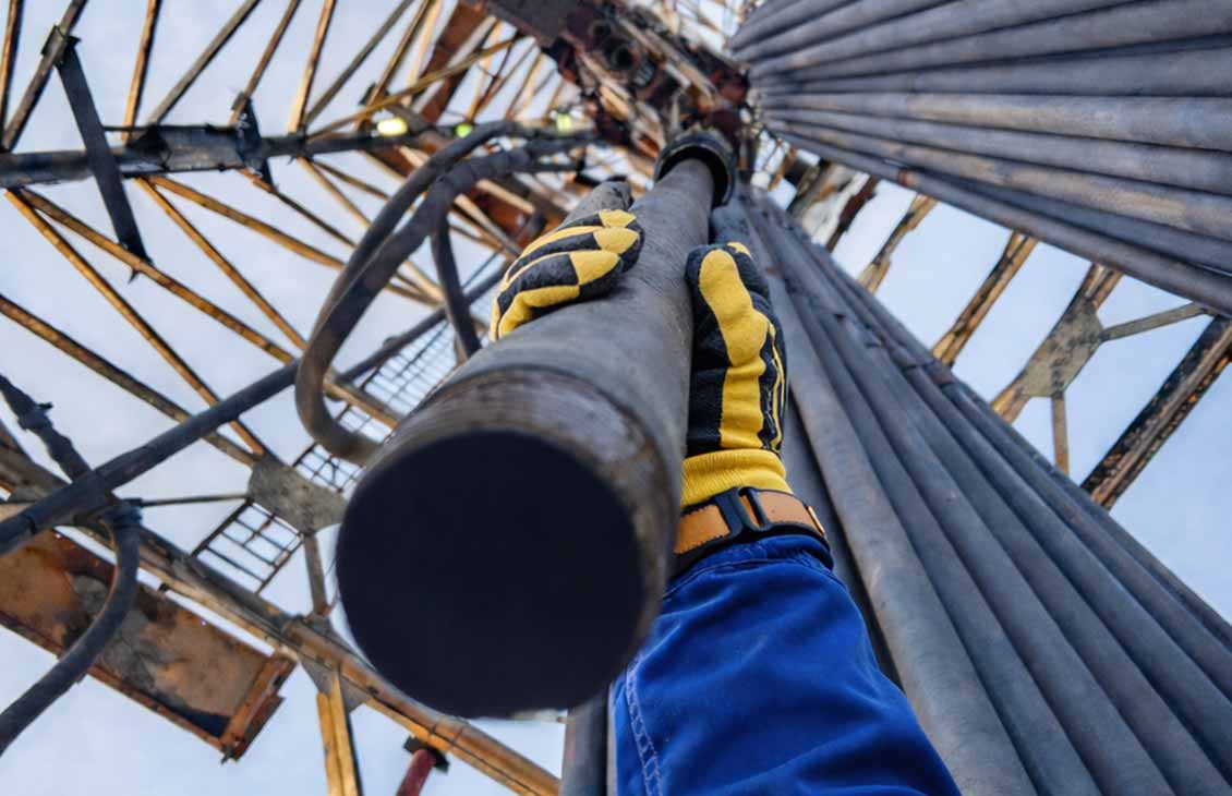 Photo of Xcelis liner hanger system suspended in the derrick before running in hole.