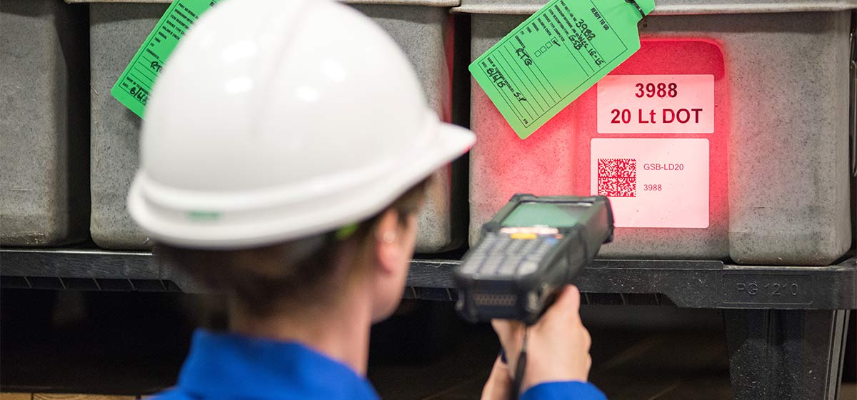 Schlumberger worker scans inventory at a manufacturing facility.