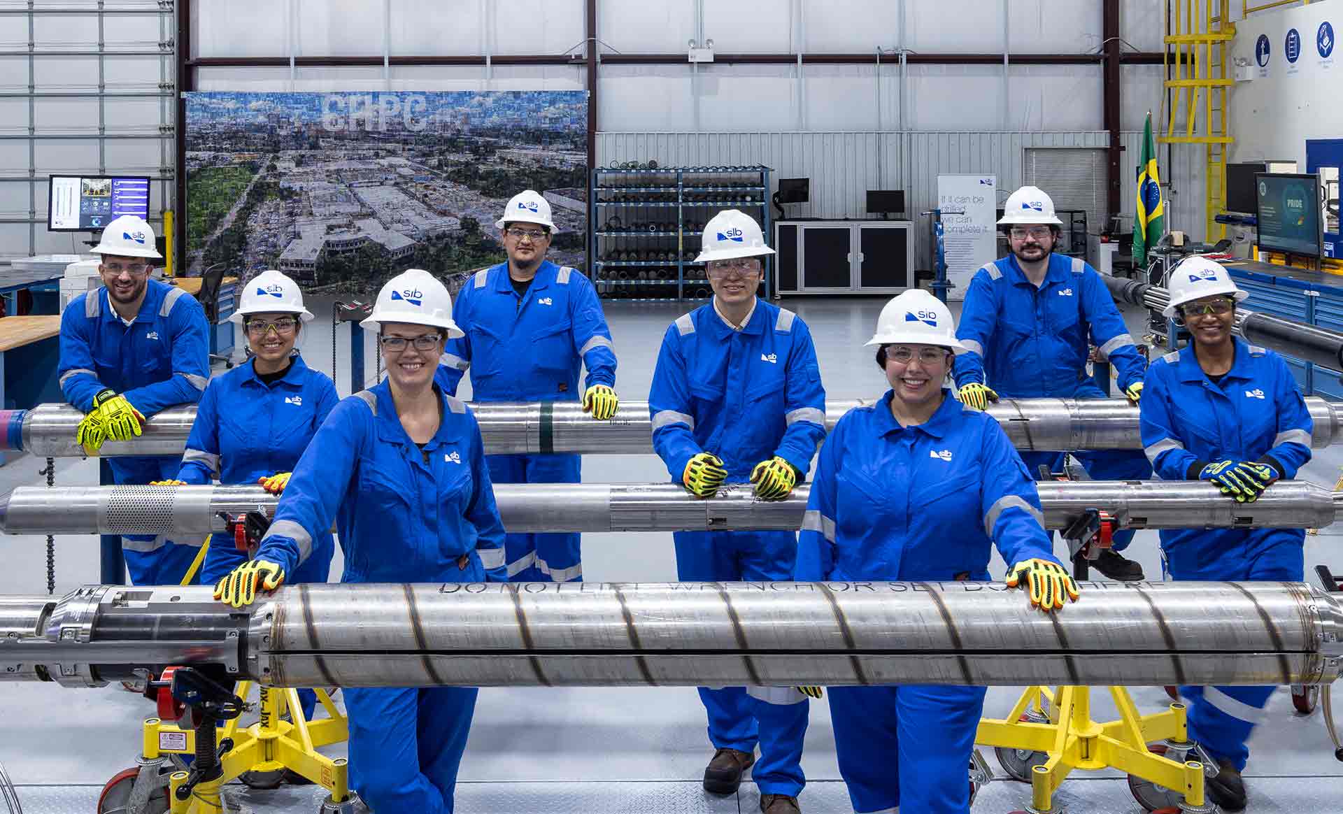 Photograph of the SLB  team standing with Electris completions technology