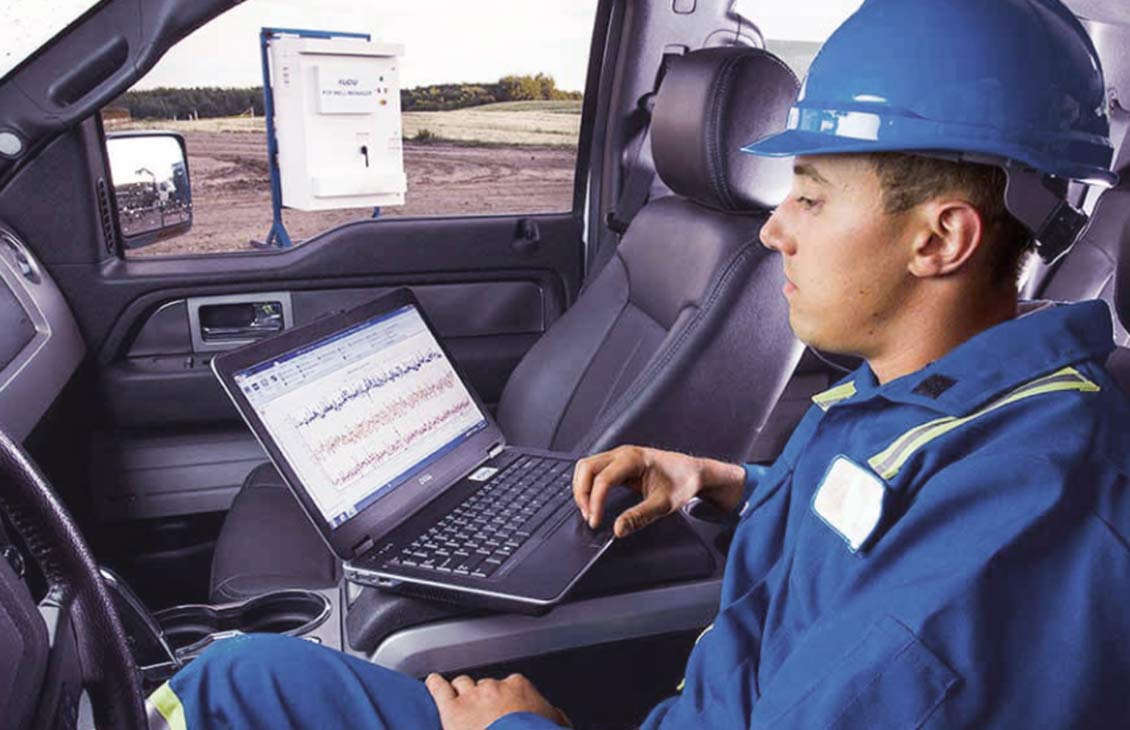 Schlumberger employee in field truck.