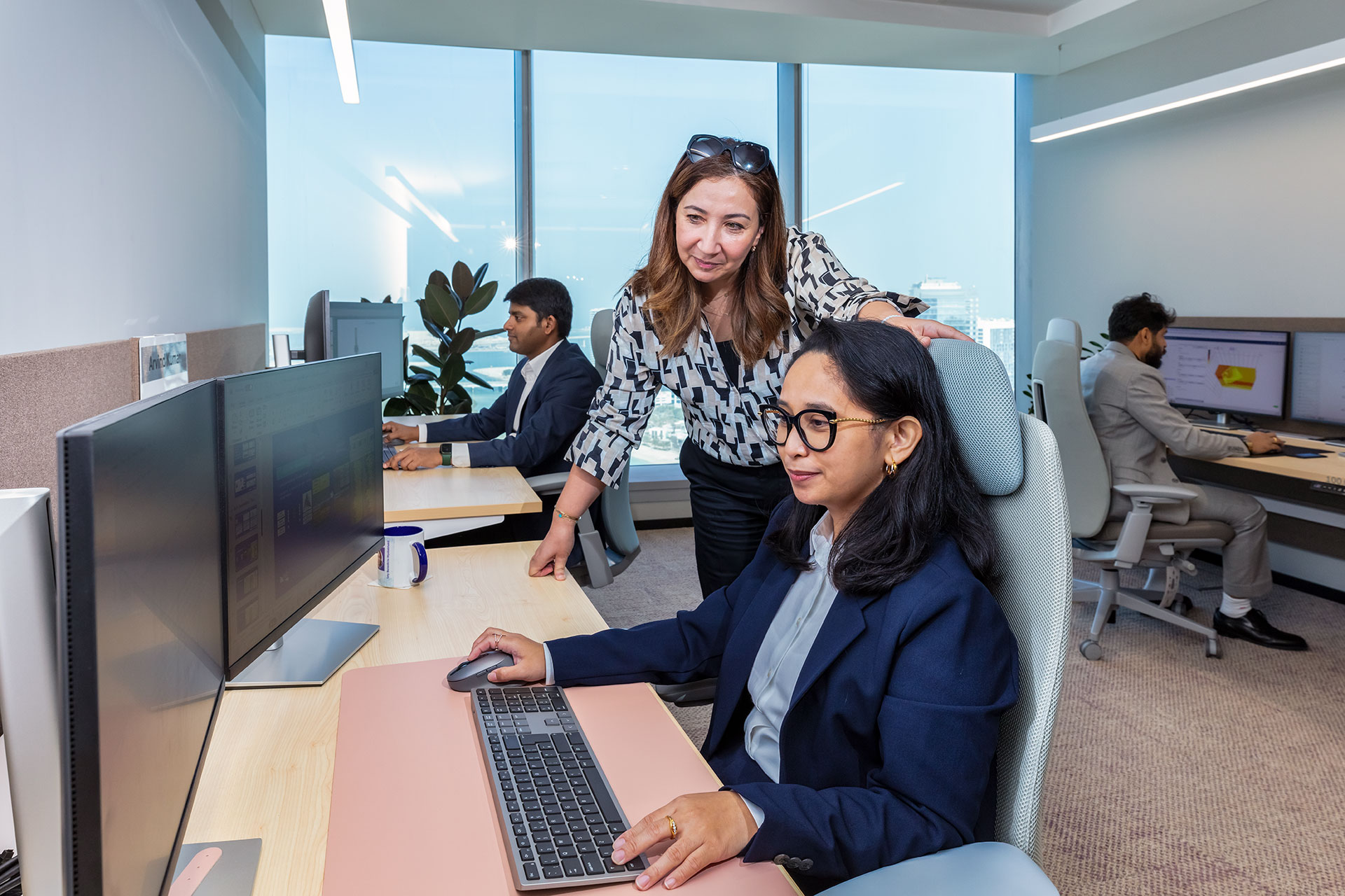 hero image of two women working at a computer