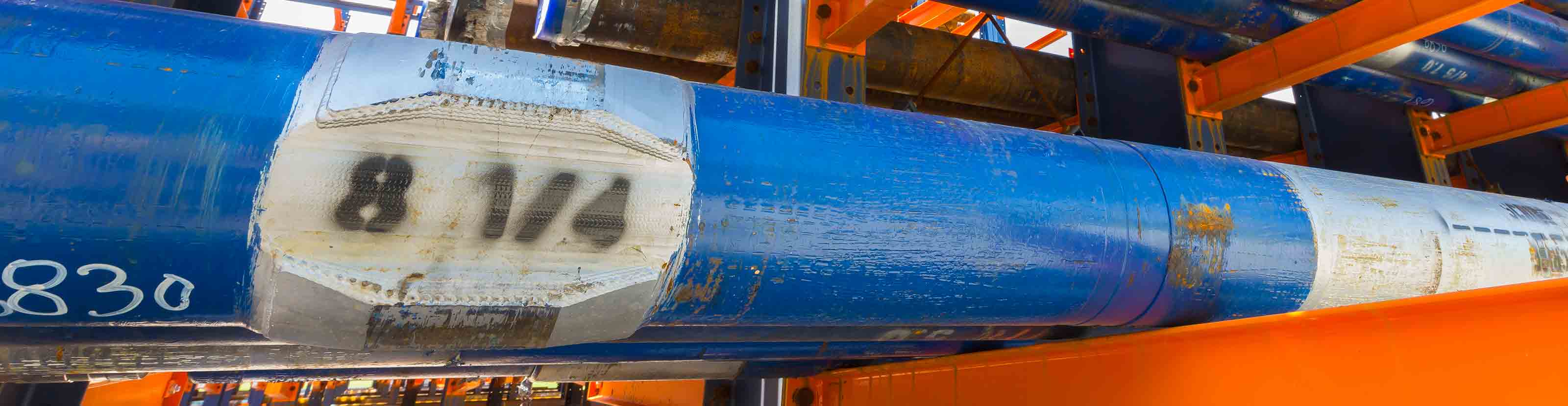A blue 8.25-in drilling motor sitting on an orange storage rack