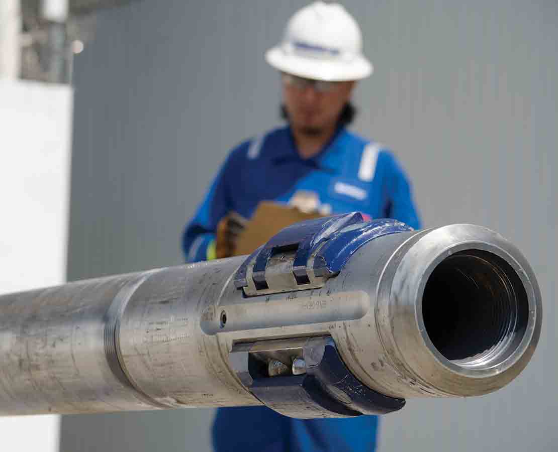 The bit-end of a PowerDrive ICE RSS as it is reviewed by a Schlumberger field technician