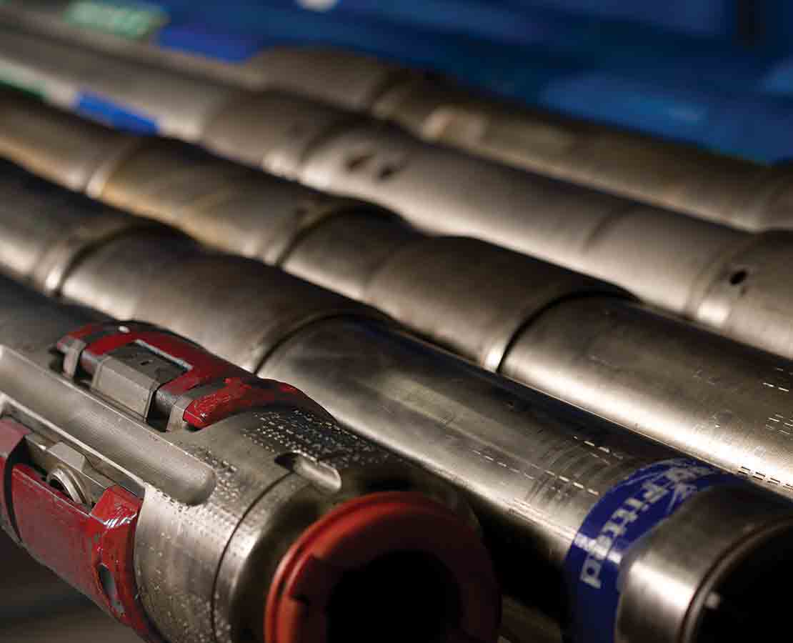 A storage rack holding various BHA components, including a PowerDrive X6 RSS