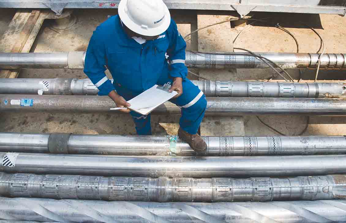 A Schlumberger technician taking inventory of the various LWD tools available for use at a rigsite