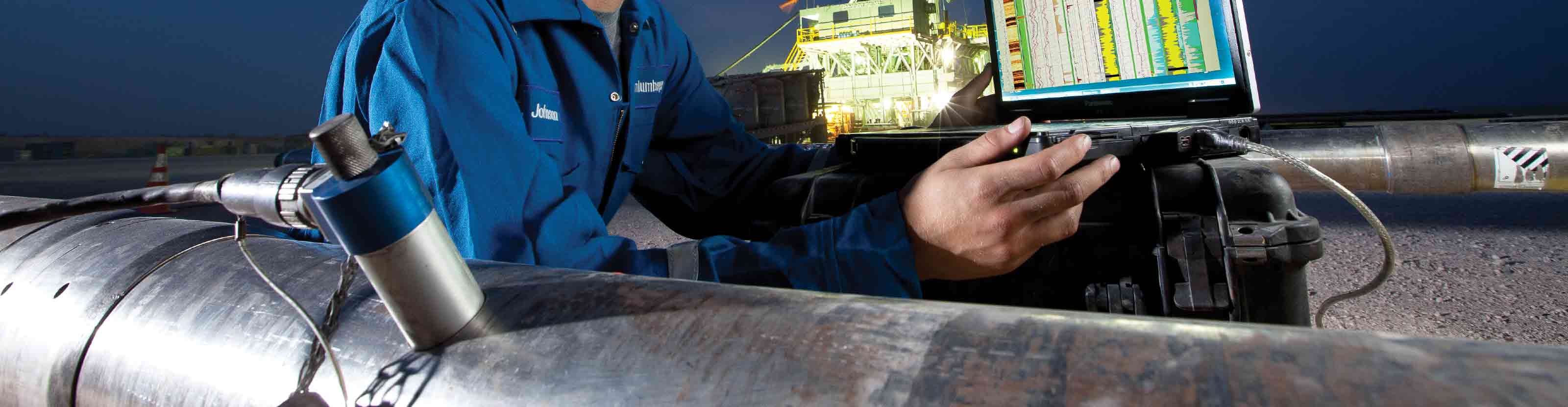 A Schlumberger technician uses a connected computer to perform final checks on a NeoScope sourceless formation evaluation-while-drilling-service tool