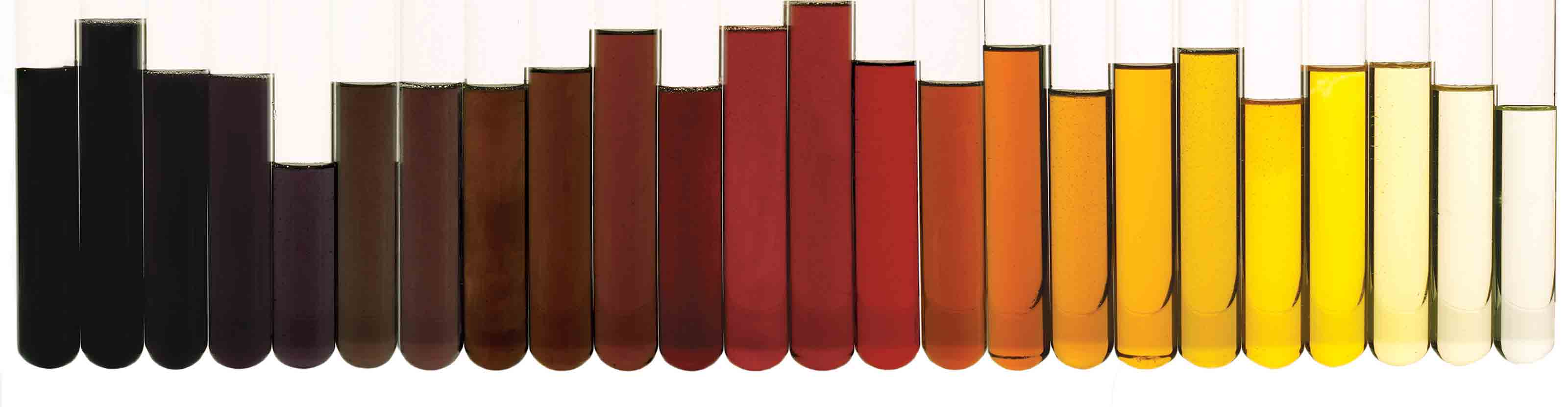 Test tubes holding different weights of oil, arranged from darkest to lightest.