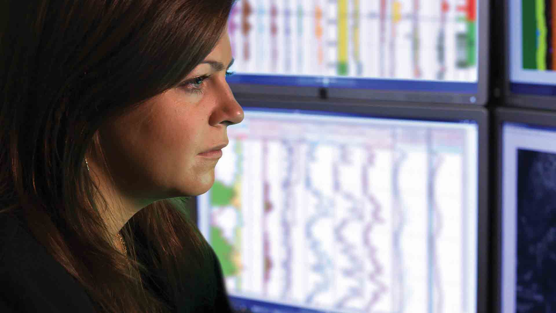 Man reviewing log data on a computer screen