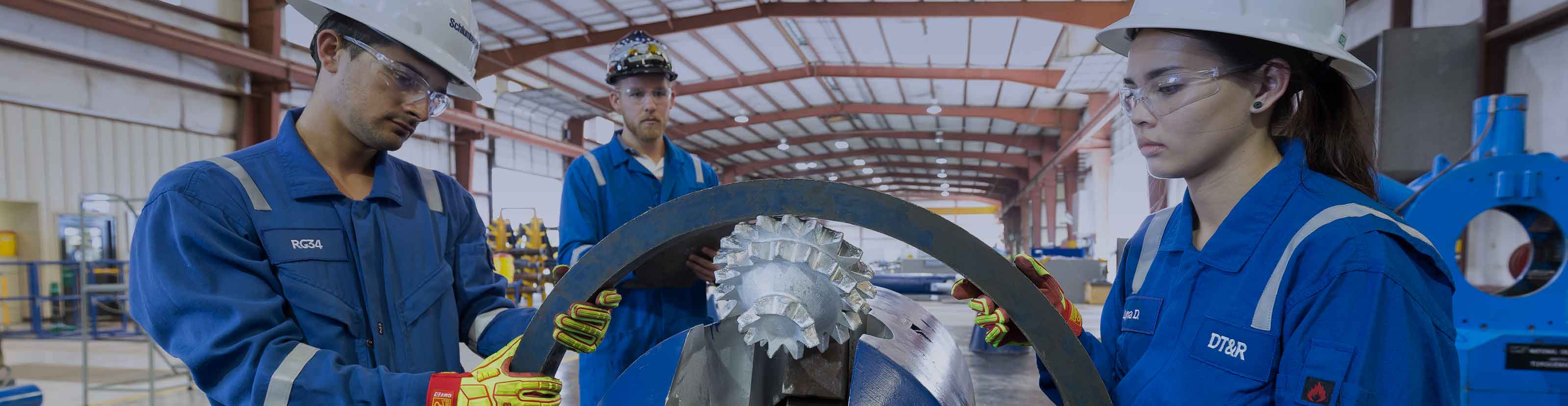 Workers inspecting underreamer