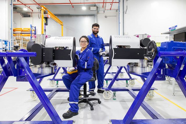Two SLB employees facing the camera at the technology center
