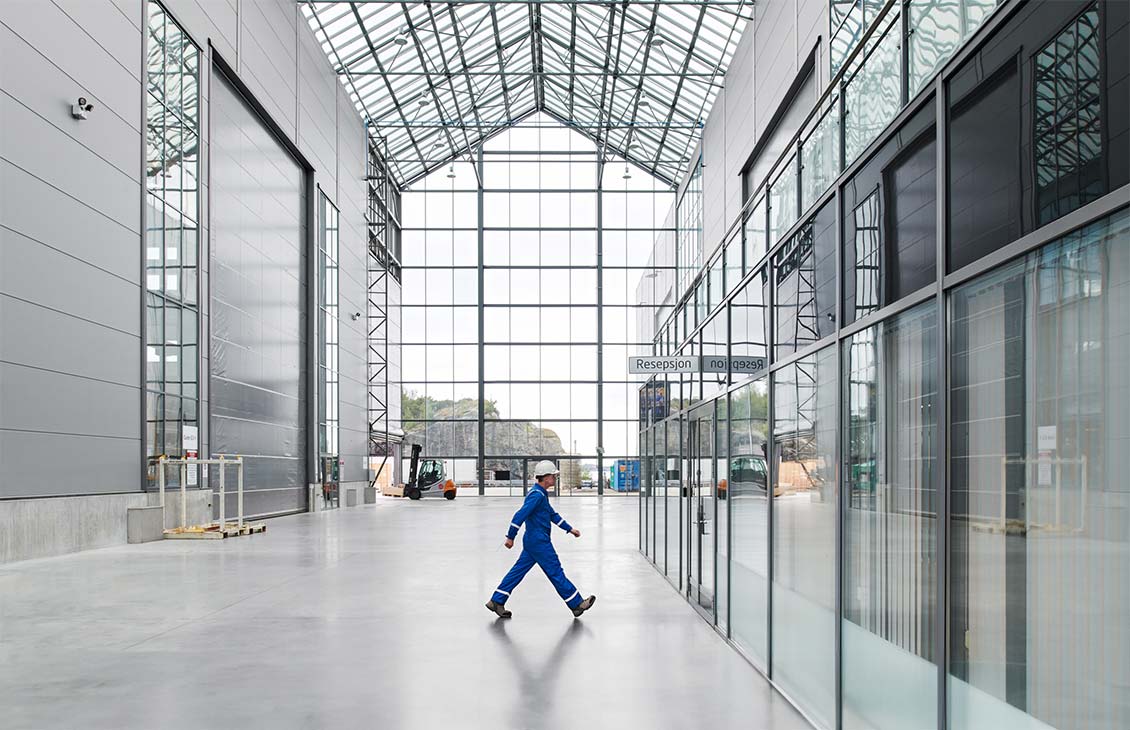 SLB operator walking across a facility floor