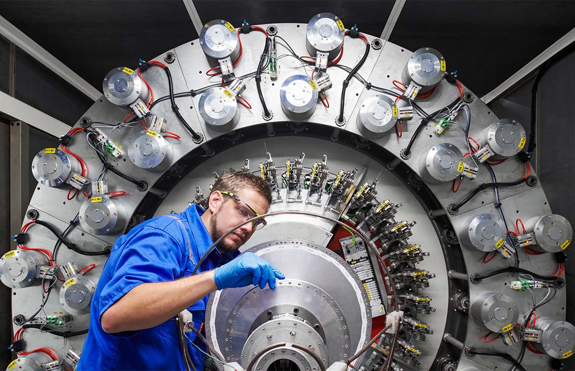 SLB operator inspecting machinery