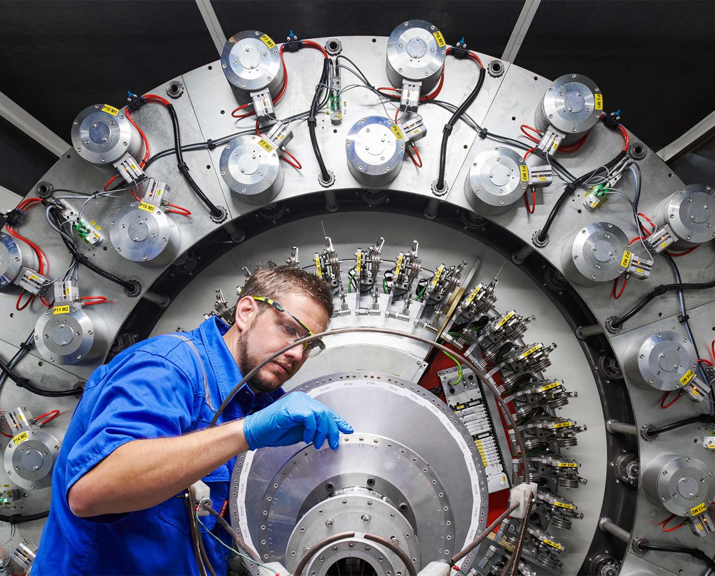 SLB operator inspecting machinery