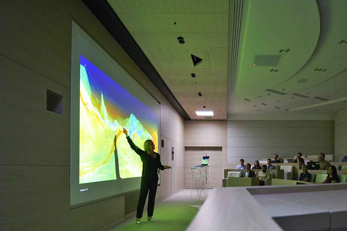 Woman presenting subsurface model in front of class