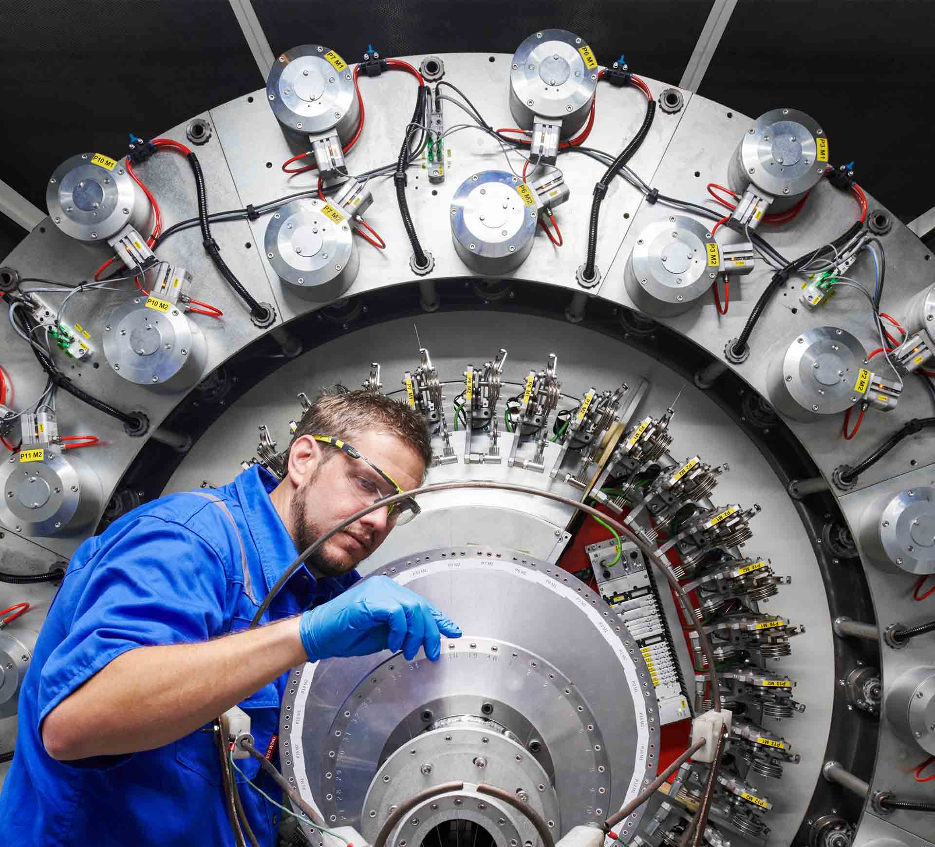 Male engineer working on a big piece of equipment