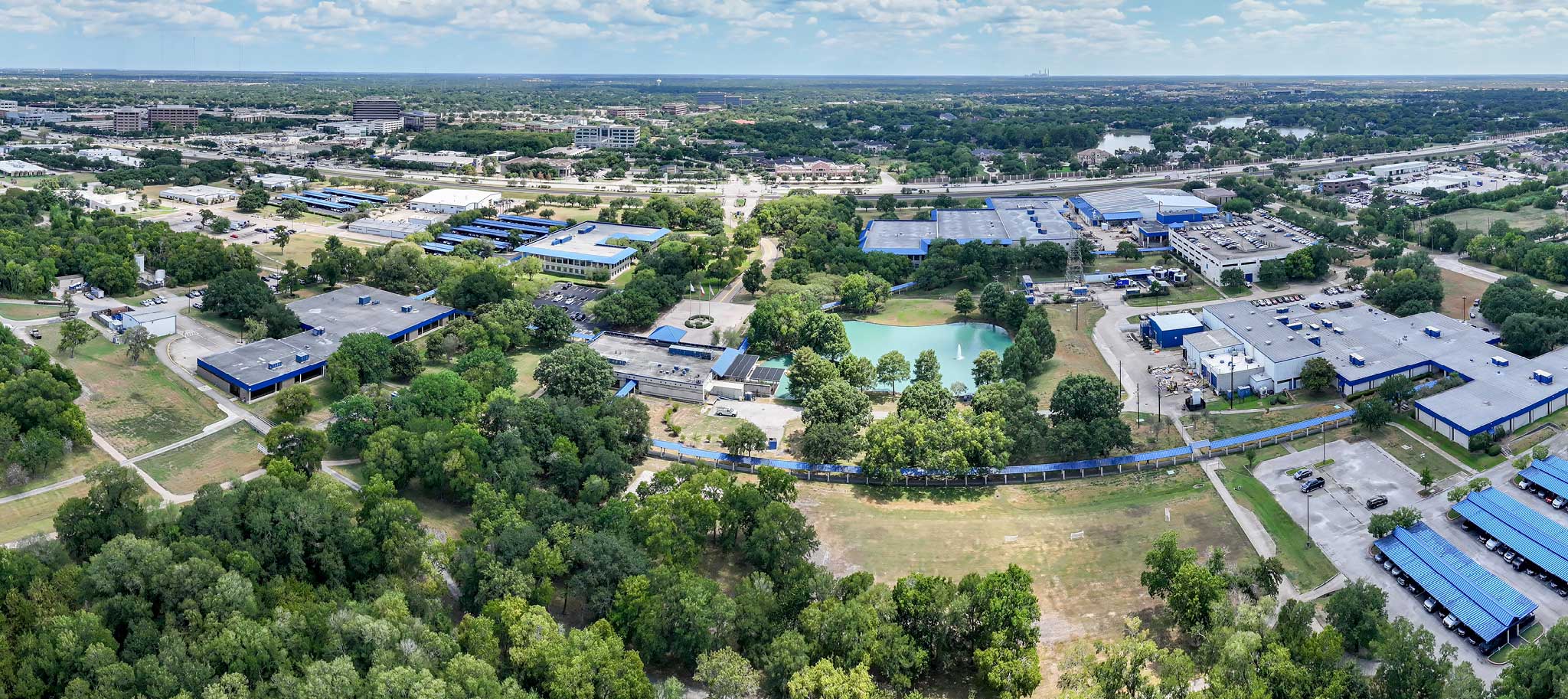 green fields and factory from above