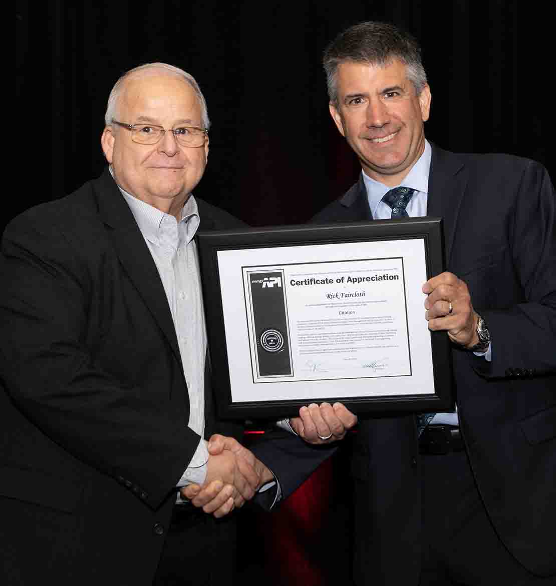 Rick Faircloth receiving framed API Citation of Achievement award.