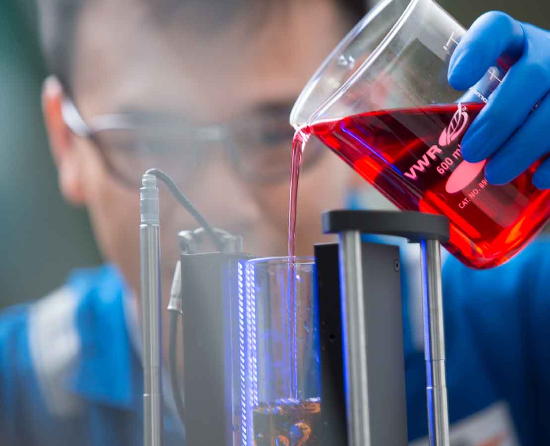 Laboratory worker testing clear brines