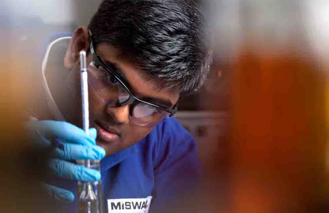 Man in gloves in laboratory.