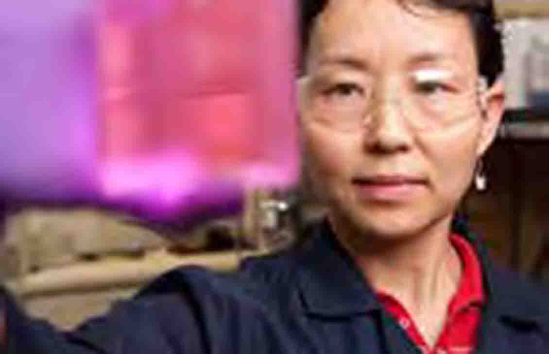 Woman employee in fluids laboratory.