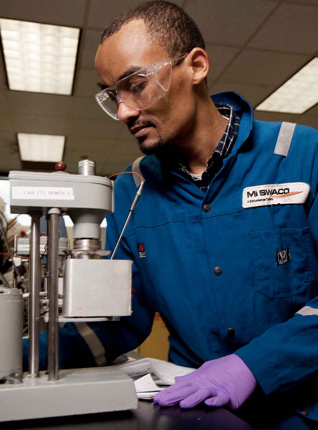 Lab worker testing fluids