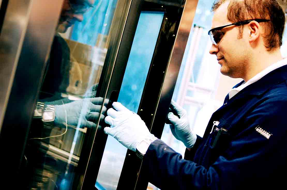A lab technician monitoring a fluid test