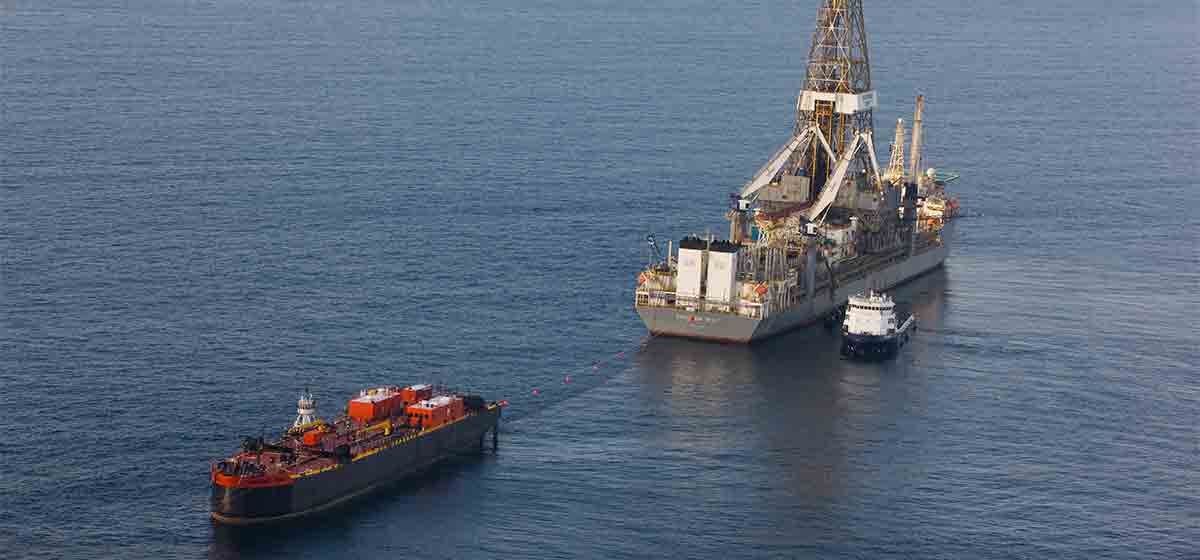 Transocean rig ship and tugs on the ocean