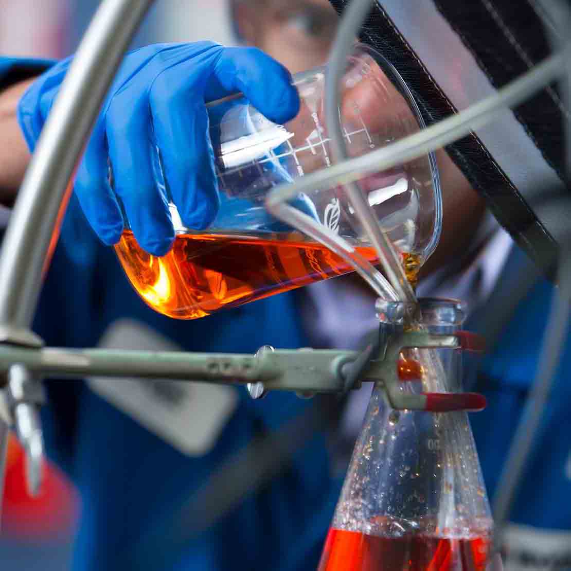 A lab technician working in an M-I SWACO chemistry lab