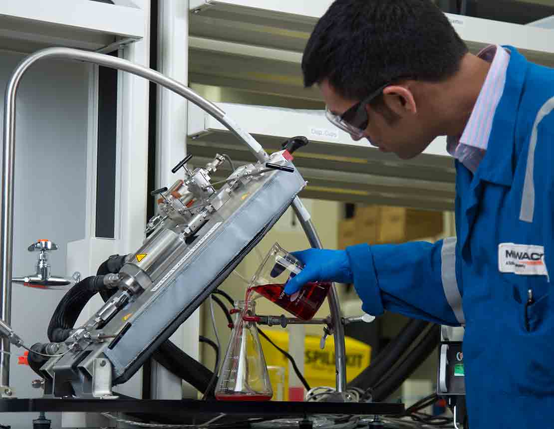 A lab technician beginning a fluid test