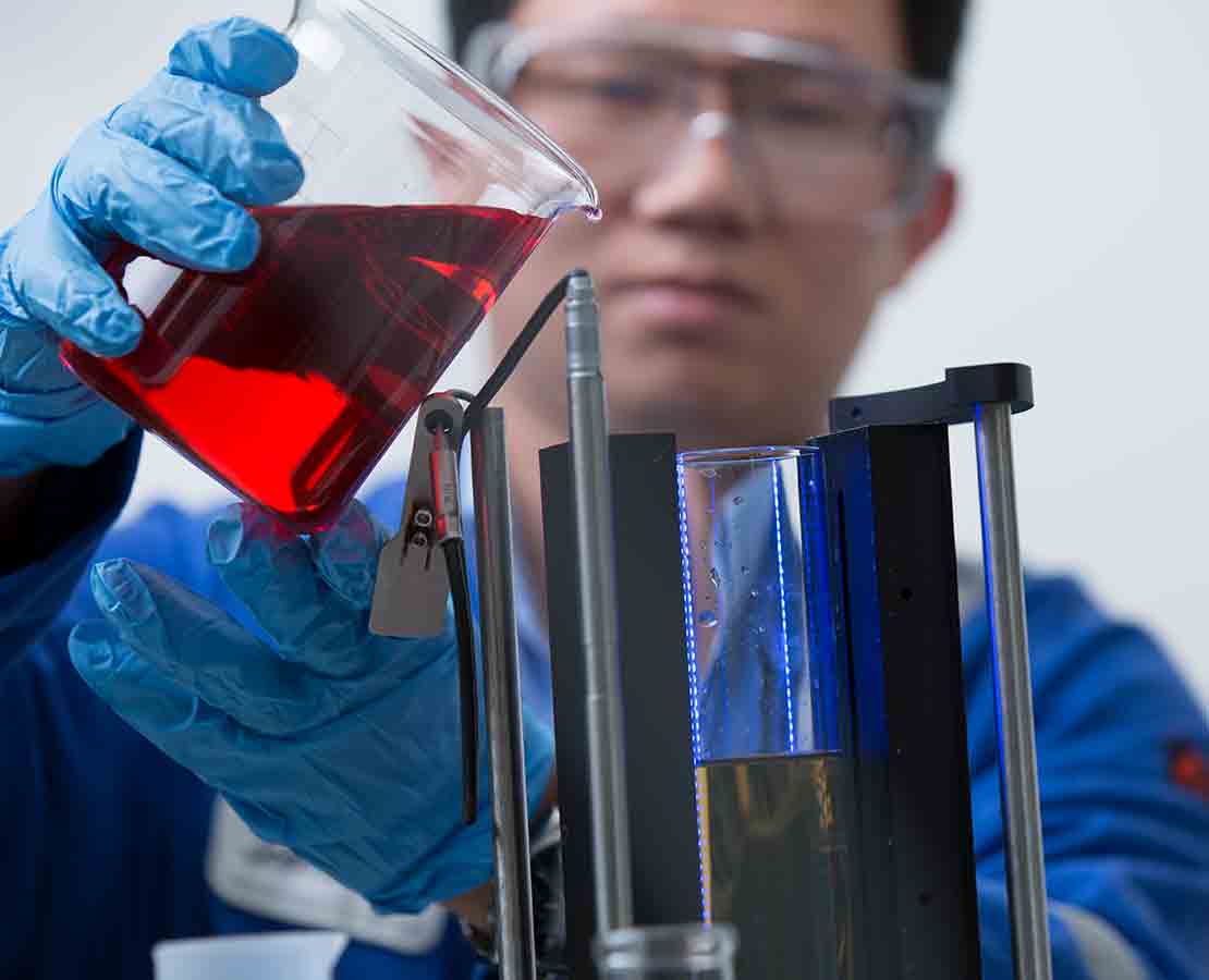 Lab worker testing liquids