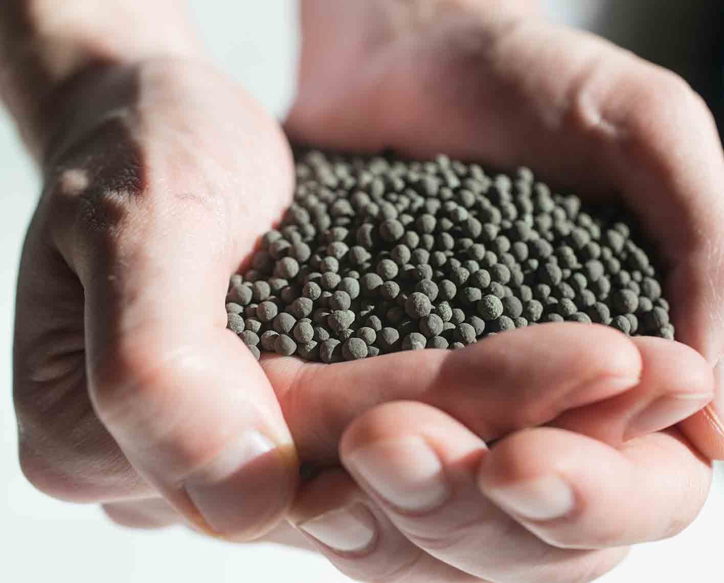 SELECT Hg mercury removal adsorbent granules in the palm of a hand.