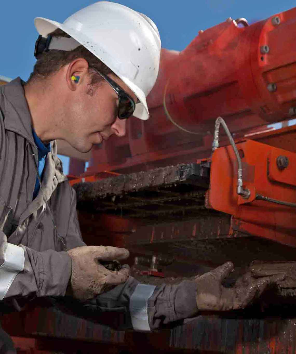 Man performance maintenance checks on MD-2 dual-deck shaker.